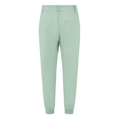 Women's cuffed golf trousers in green with belt loops, pockets and four-way stretch fabric