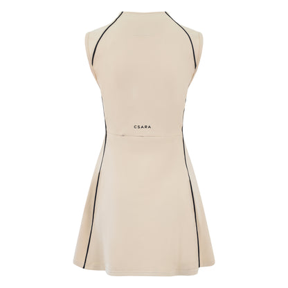 Women’s sleeveless golf dress in sand with half-zip front, stretch frabic and pockets