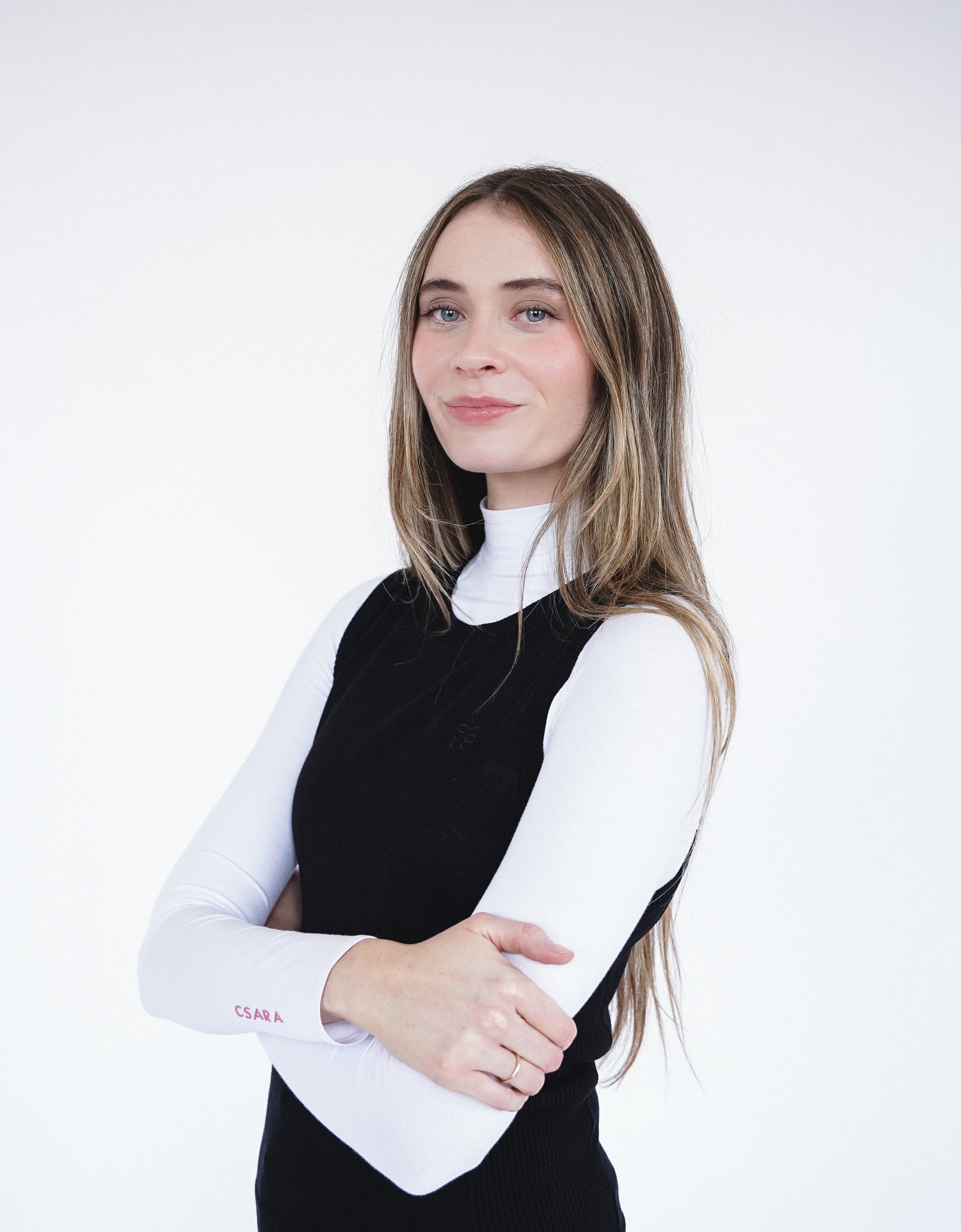 CSARA Raven knitted vest in black, women’s sleeveless golf knitwear shown from the side profile. 