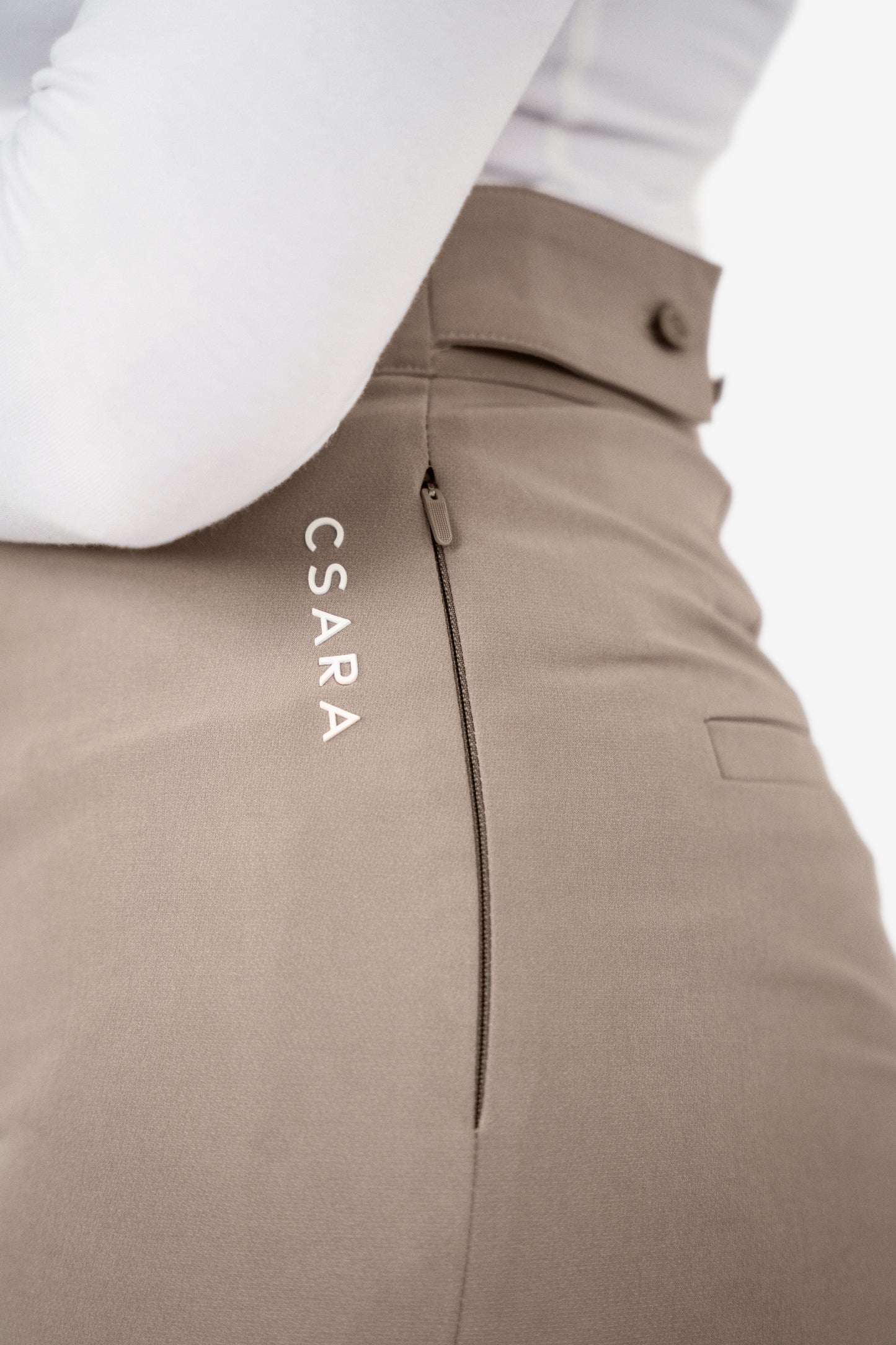 Detail view of side zip, mocha brown trousers