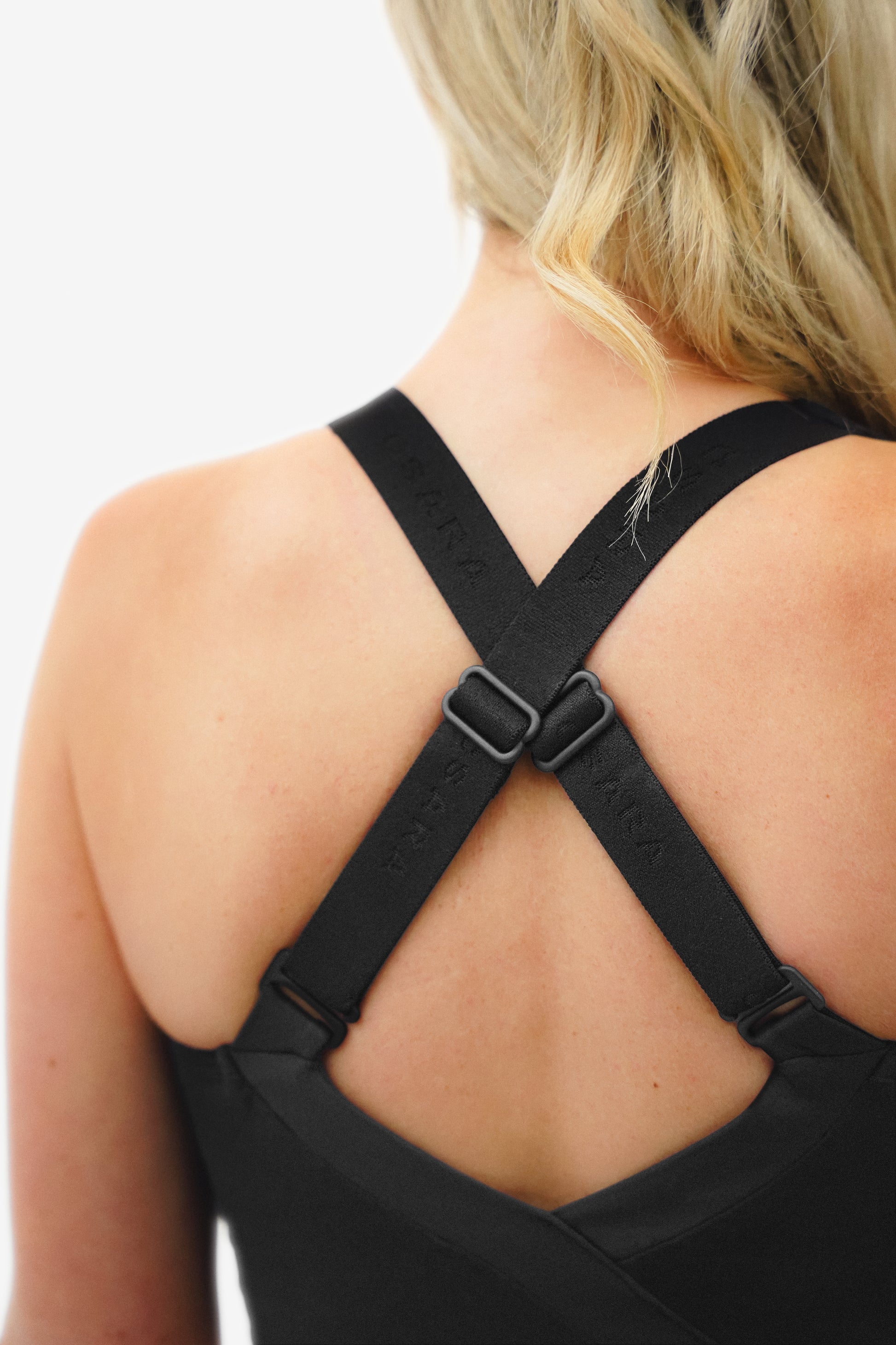 Black long-line Sports Bra, with brown logo