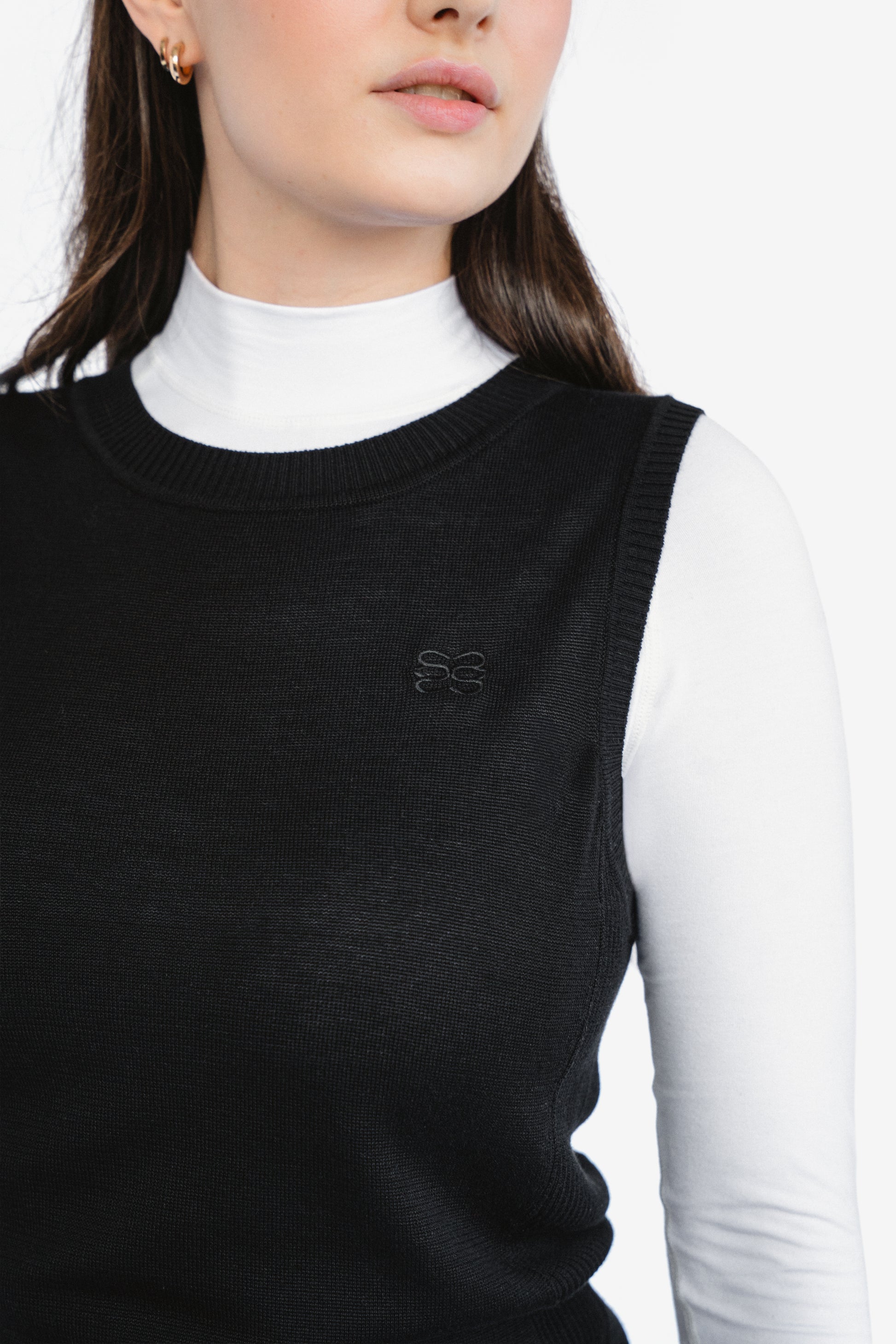 CSARA Raven knitted vest in black, women’s sleeveless golf knitwear, close-up image.